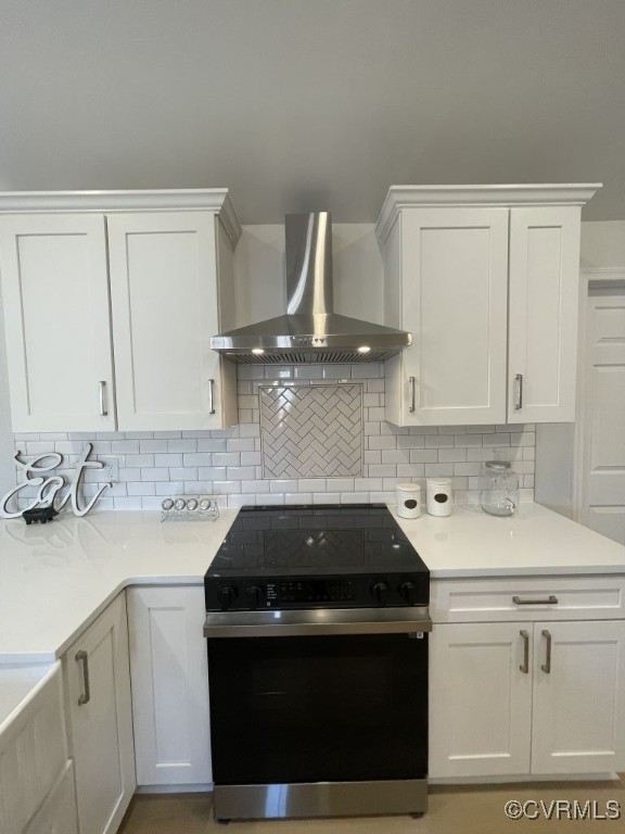 471 Pedro Pitts Road Caret, VA 22436 - Photo 8 of 19 Kitchen with electric range, white cabinets, decor
