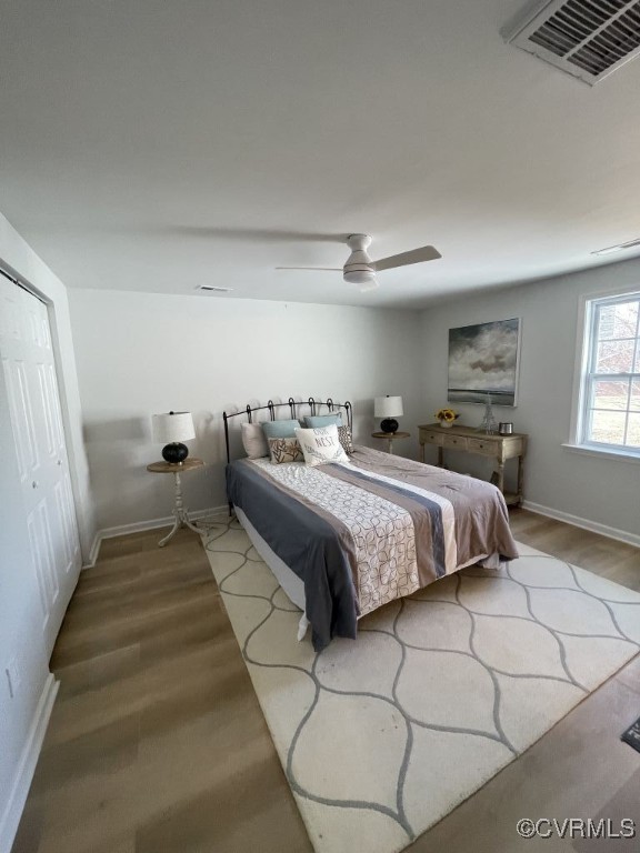 471 Pedro Pitts Road Caret, VA 22436 - Photo 9 of 19 Bedroom featuring a ceiling fan, wood finished flo