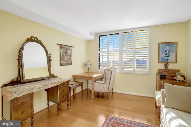 a bathroom with a granite countertop sink vanity and mirror