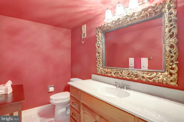 a bathroom with a glass shower door and a window