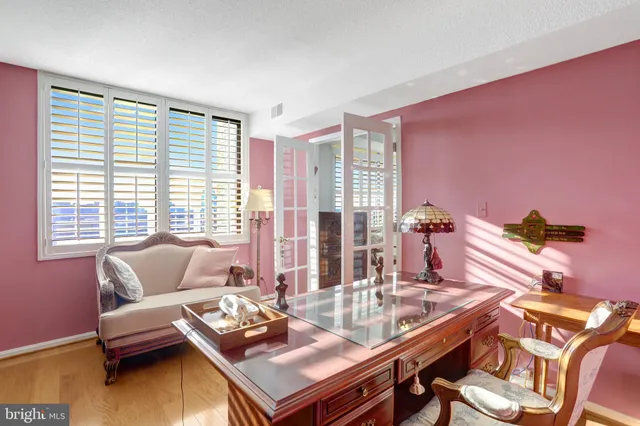 a kitchen with a sink refrigerator and cabinets