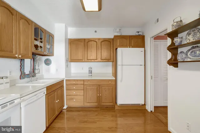 a kitchen with sink cabinets and microwave