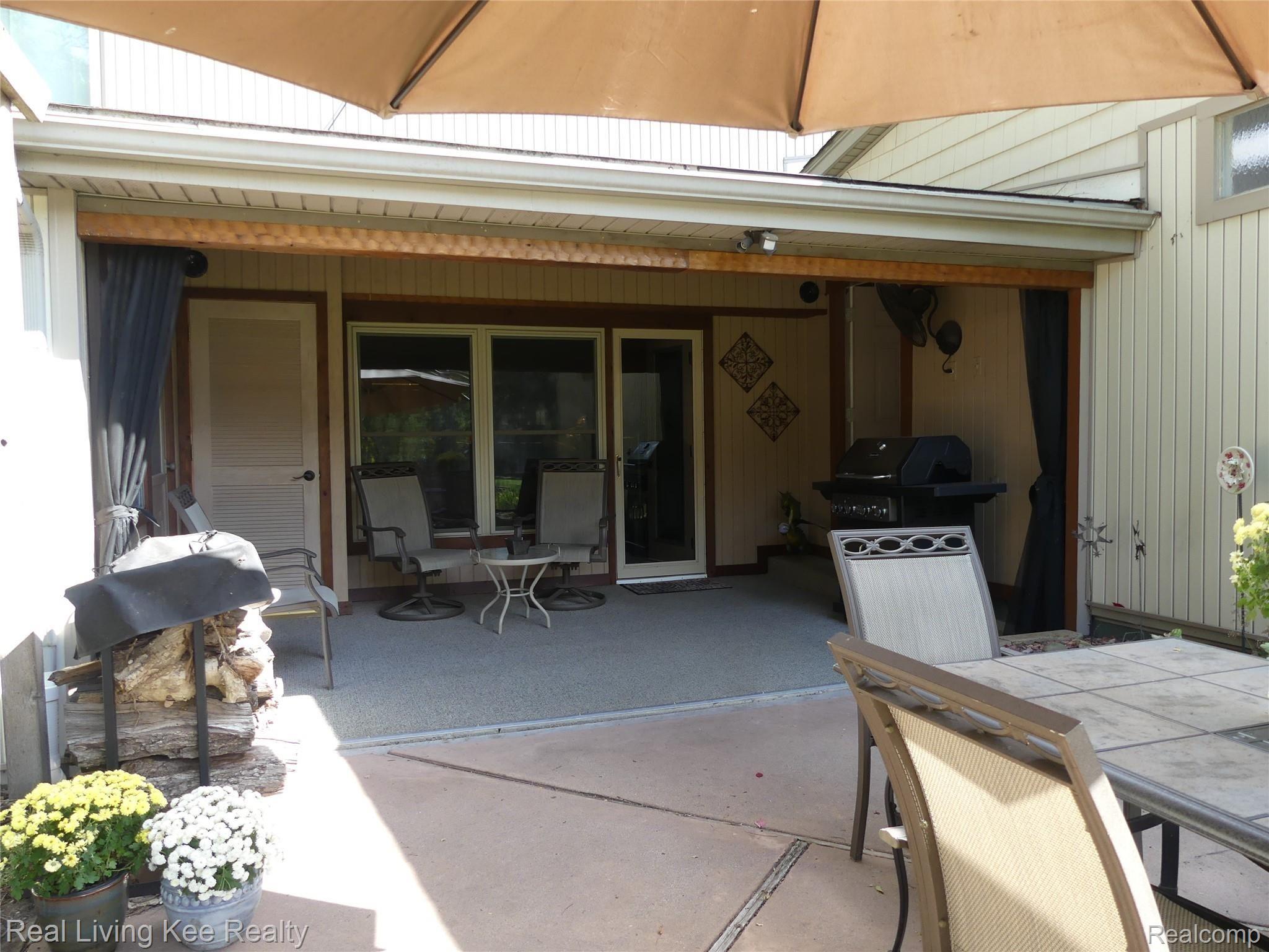 49741 Shelby Road Utica, MI 48317 - Photo 56 of 61 View of screened porch from patio.