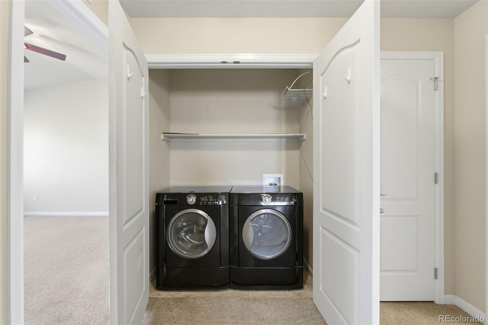 6223 Kilmer Loop, Unit 201 Golden, CO 80403 - Photo 17 of 44 a utility room with dryer and washer