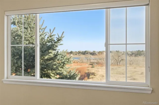 an empty room with a empty space and a ceiling fan