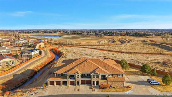 an aerial view of residential building and ocean