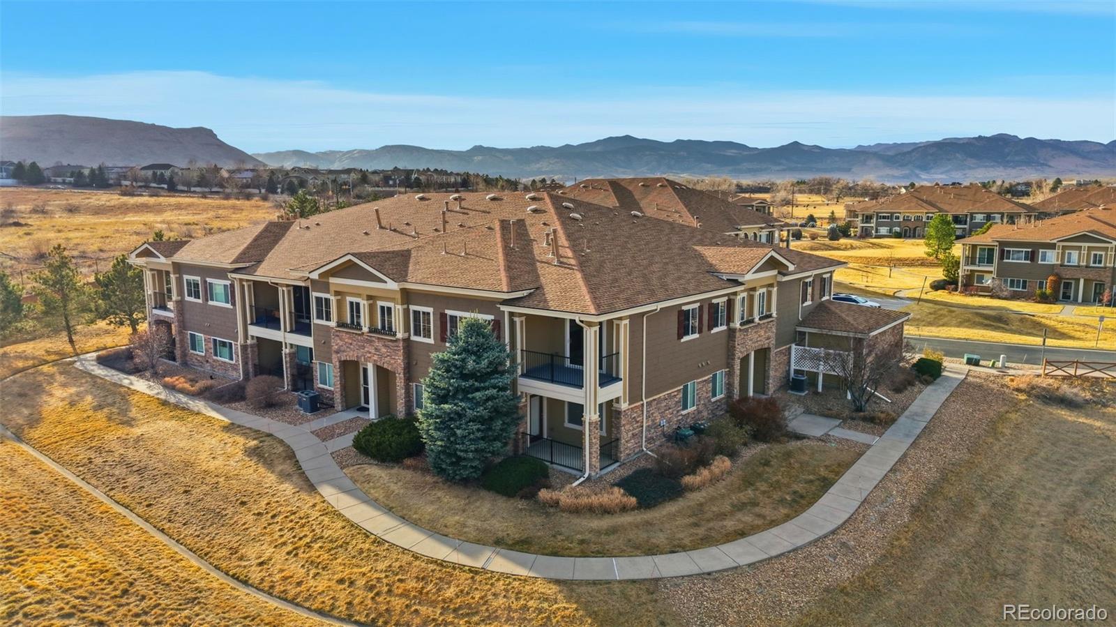 6223 Kilmer Loop, Unit 201 Golden, CO 80403 - Photo 27 of 44 an aerial view of residential houses with outdoor space and river