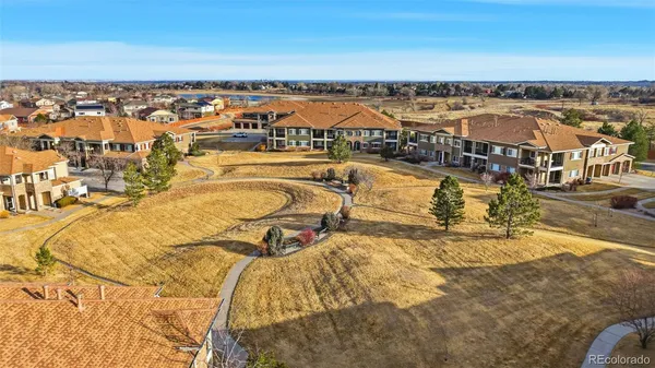 an aerial view of residential building and ocean view