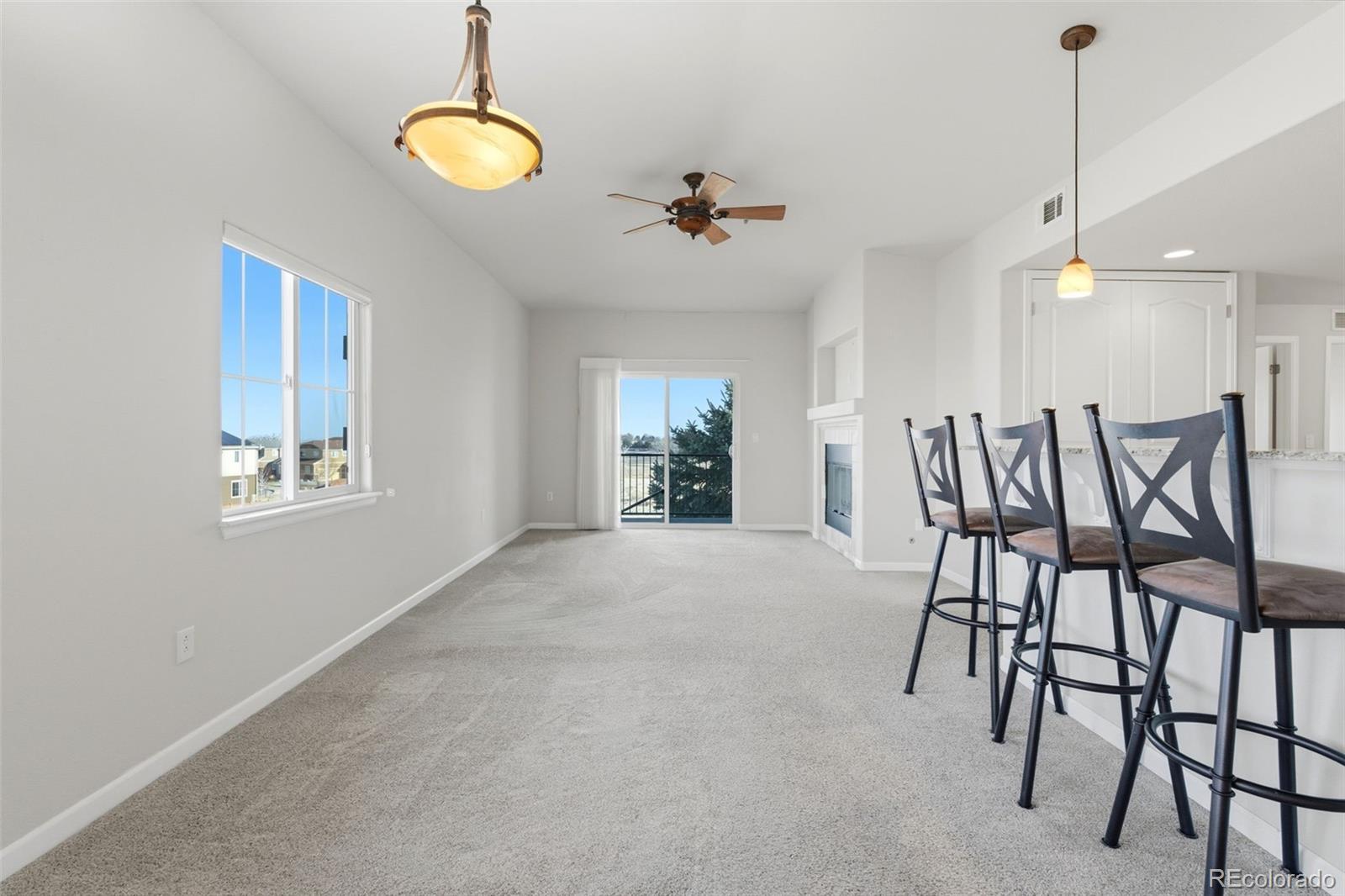 6223 Kilmer Loop, Unit 201 Golden, CO 80403 - Photo 32 of 44 a view of a dining room with furniture
