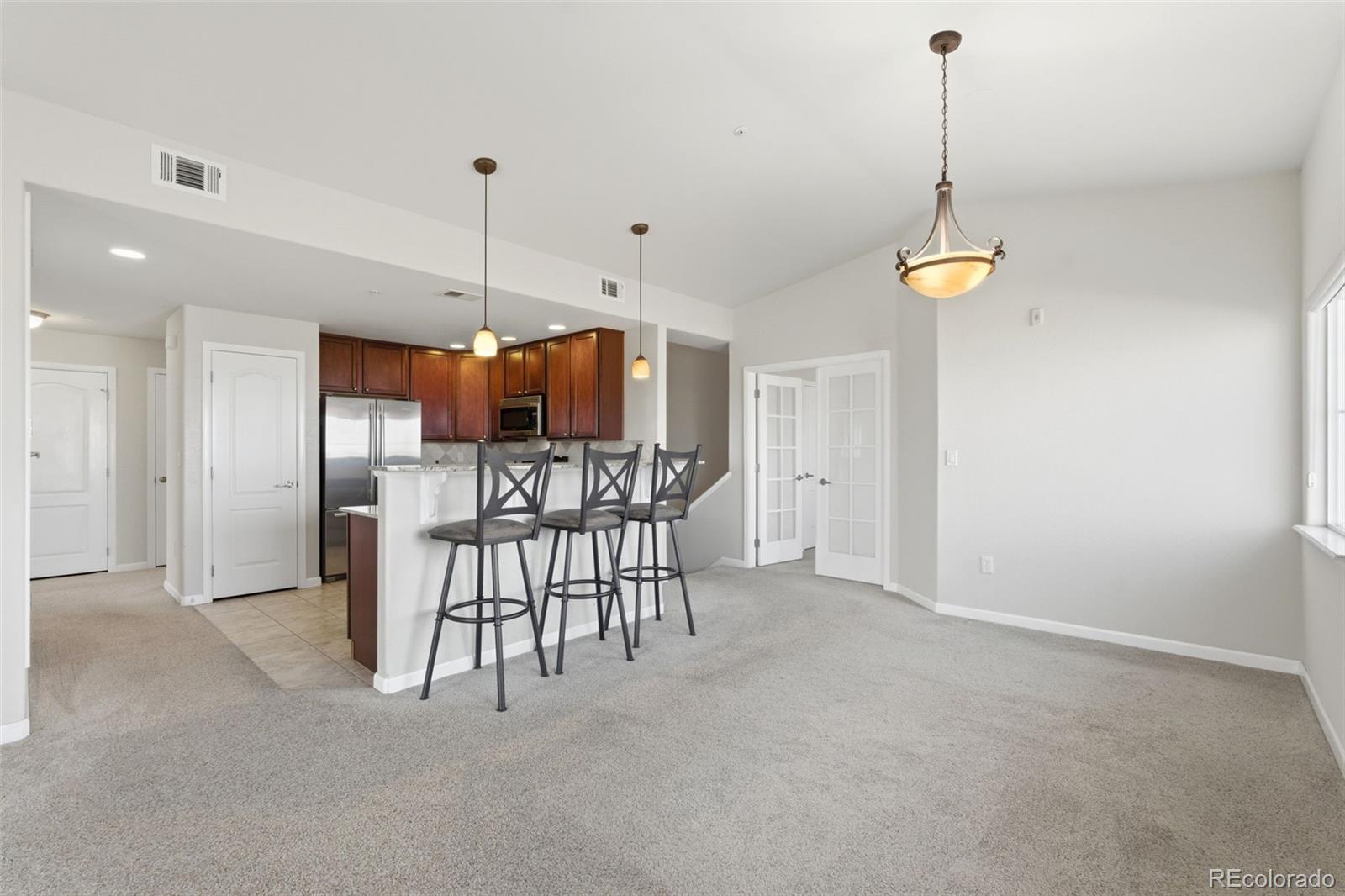 6223 Kilmer Loop, Unit 201 Golden, CO 80403 - Photo 35 of 44 a view of a dining room with furniture