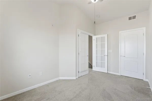 a view of room with a ceiling fan and window