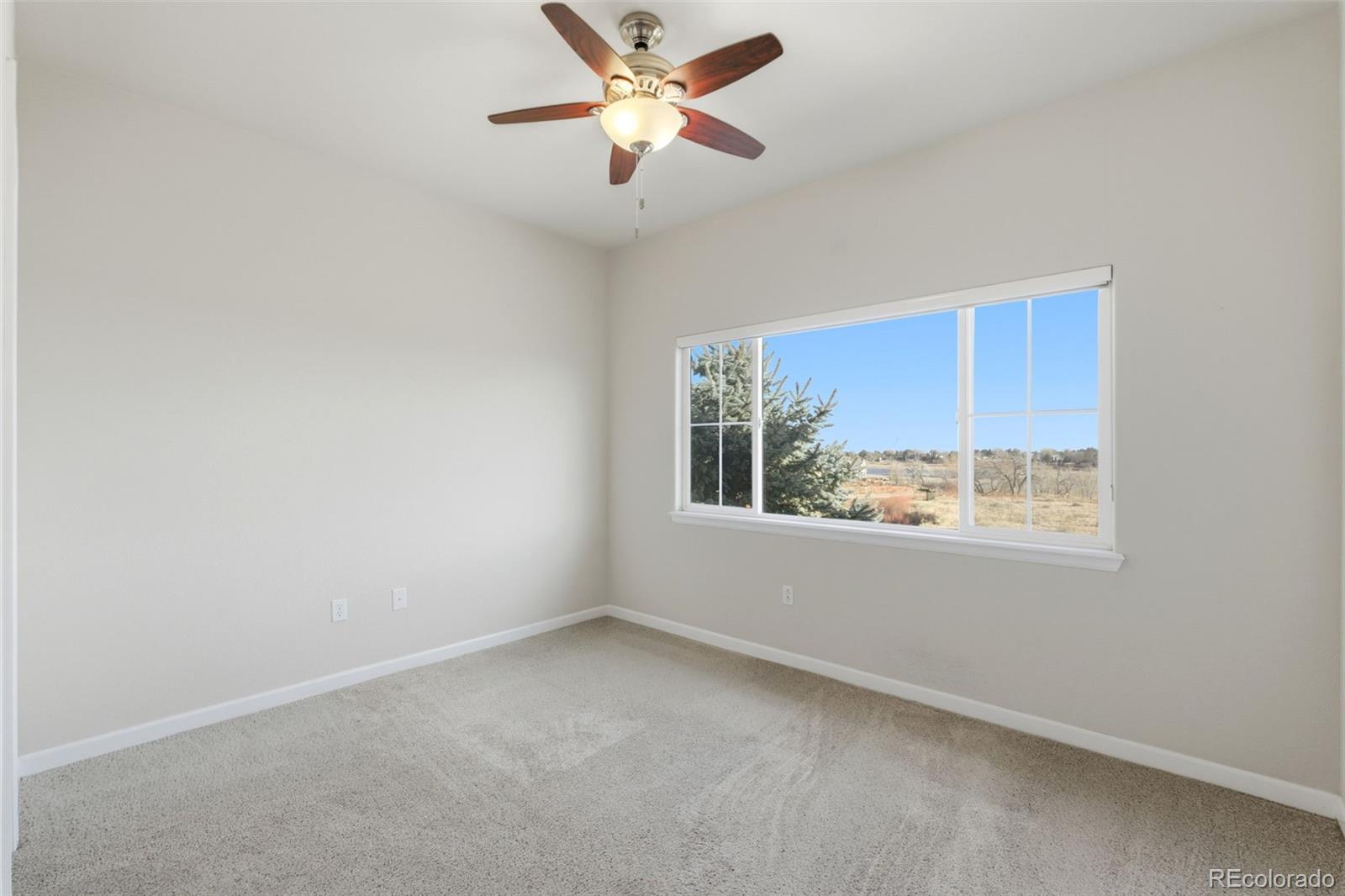 6223 Kilmer Loop, Unit 201 Golden, CO 80403 - Photo 42 of 44 an empty room with a window