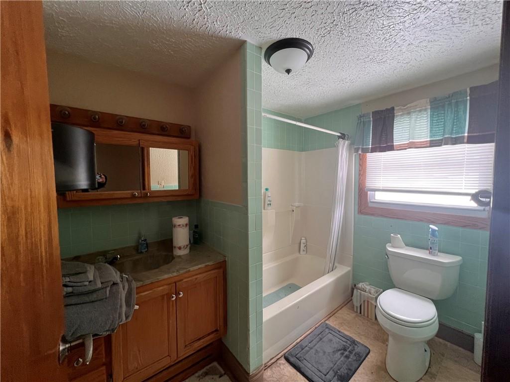 1715 Byers Road Mahaffey, PA 15757 - Photo 14 of 17 a bathroom with a granite countertop toilet sink and mirror