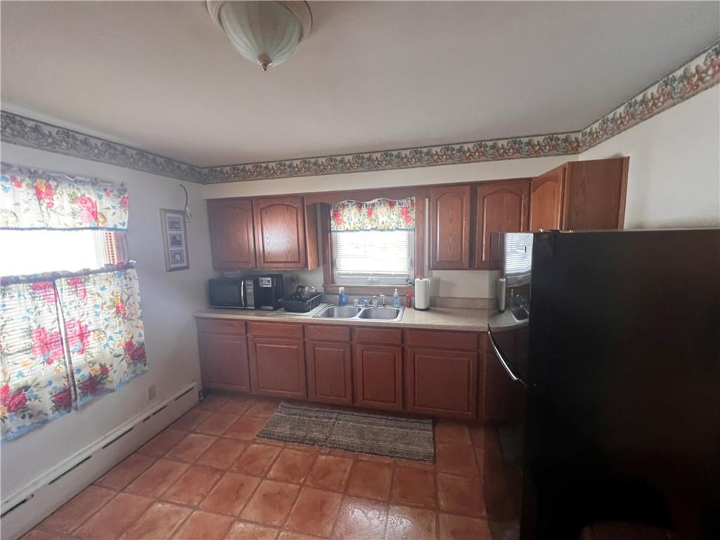 1715 Byers Road Mahaffey, PA 15757 - Photo 5 of 17 a kitchen with granite countertop a refrigerator and a stove top oven