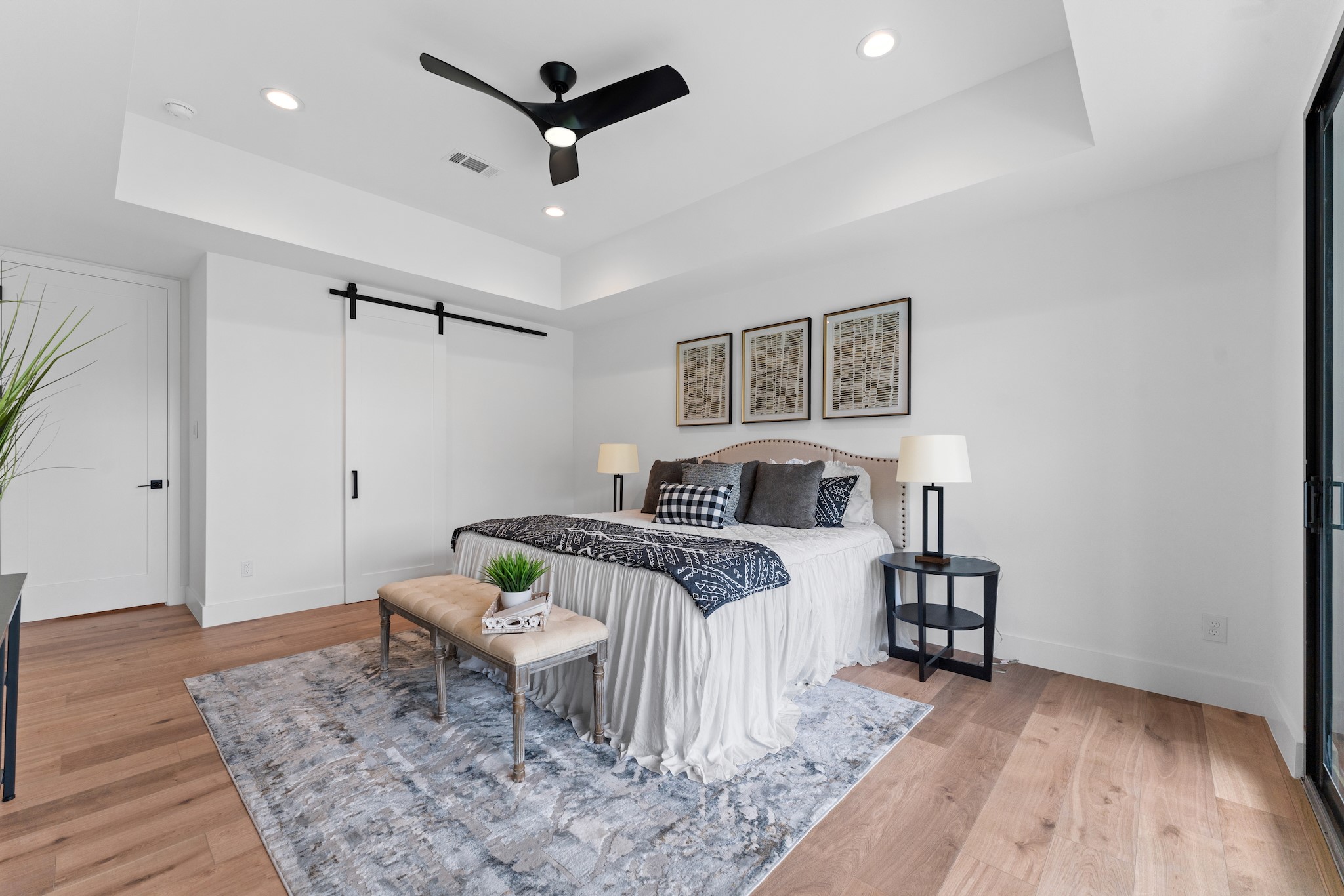 6711 Housman Houston, TX 77055 - Photo 22 of 49 Sleek modern barn doors lead to the spa-worthy bath and boutique-inspired closet.
