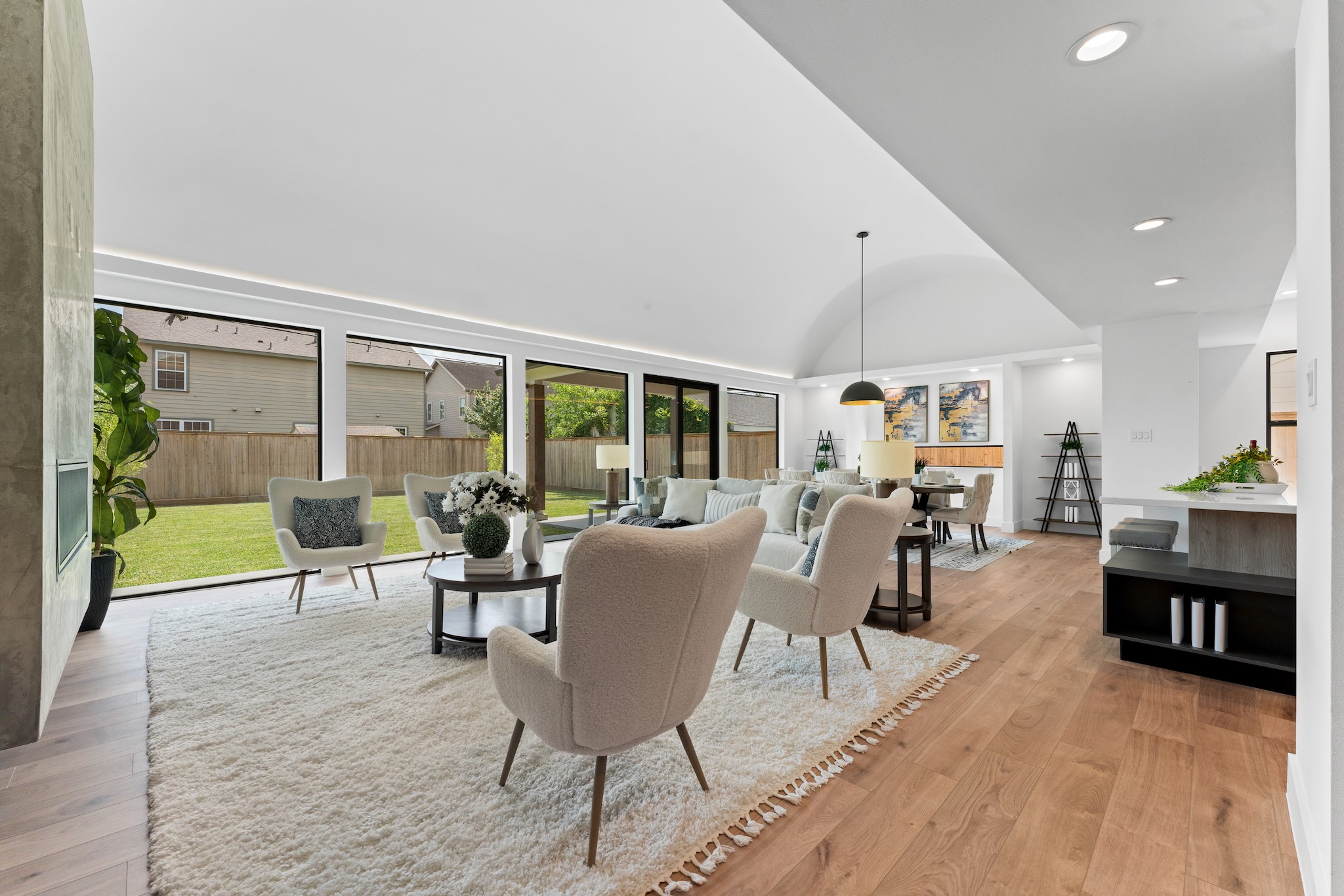 6711 Housman Houston, TX 77055 - Photo 3 of 49 Soaring barrel-arched ceilings and a wall of glass bring a breathtaking sense of space and light to everyday living.