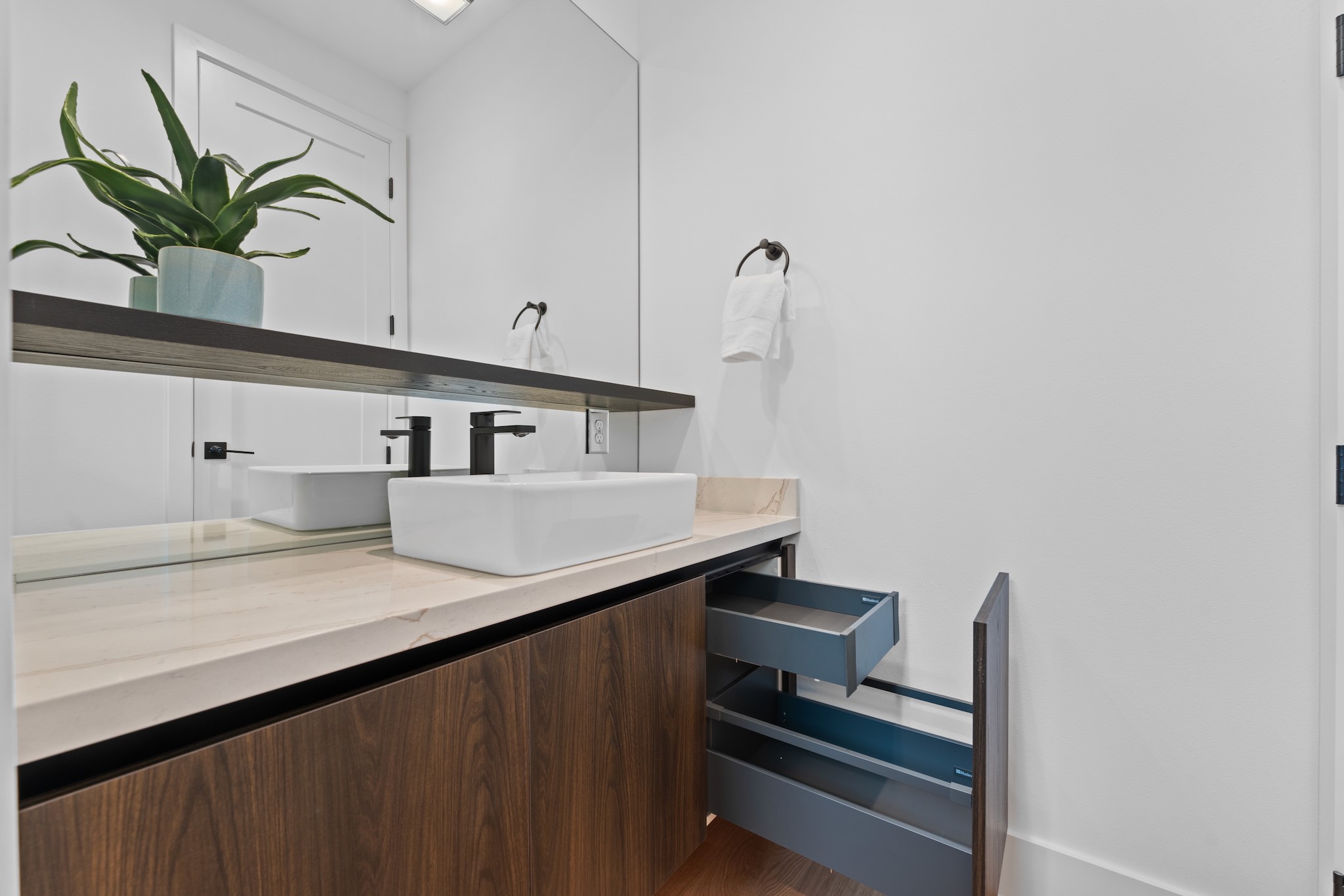 6711 Housman Houston, TX 77055 - Photo 43 of 49 Sleek storage solutions and under-cabinet lighting bring function and beauty together.