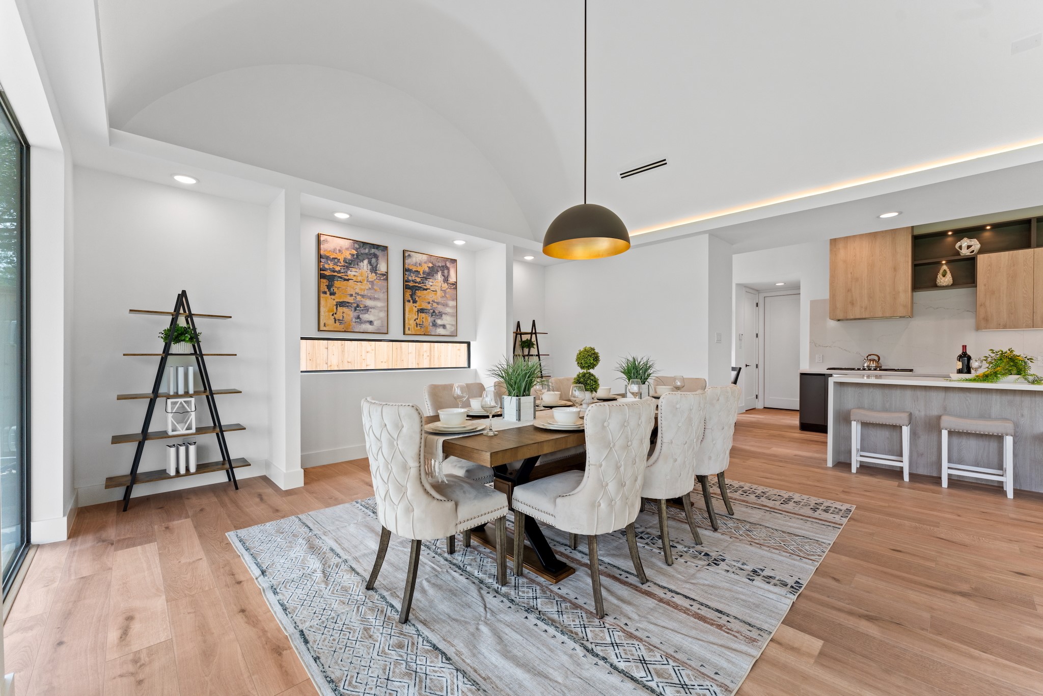 6711 Housman Houston, TX 77055 - Photo 7 of 49 Entertain beautifully under soaring ceilings and a sculptural modern chandelier that casts a warm glow day or night.