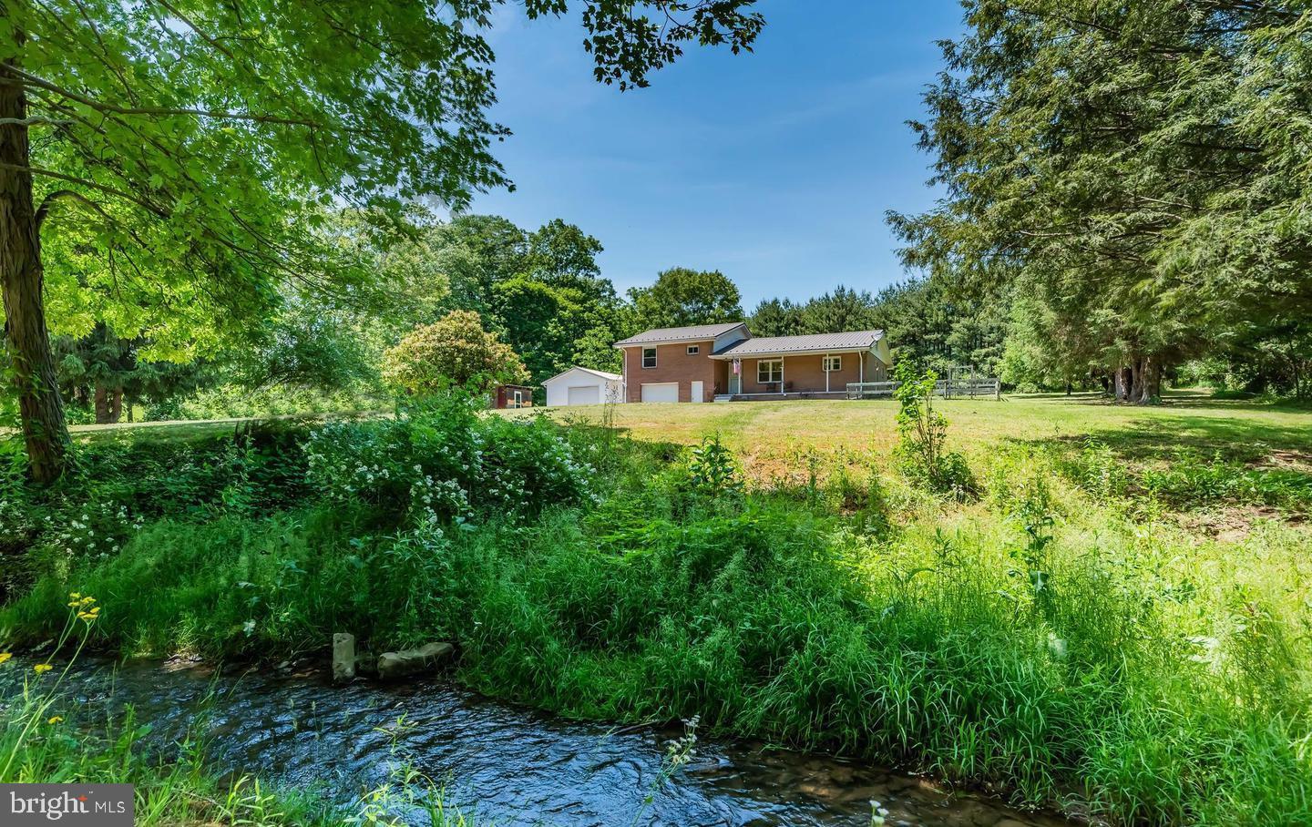 Serene home by a tranquil stream.