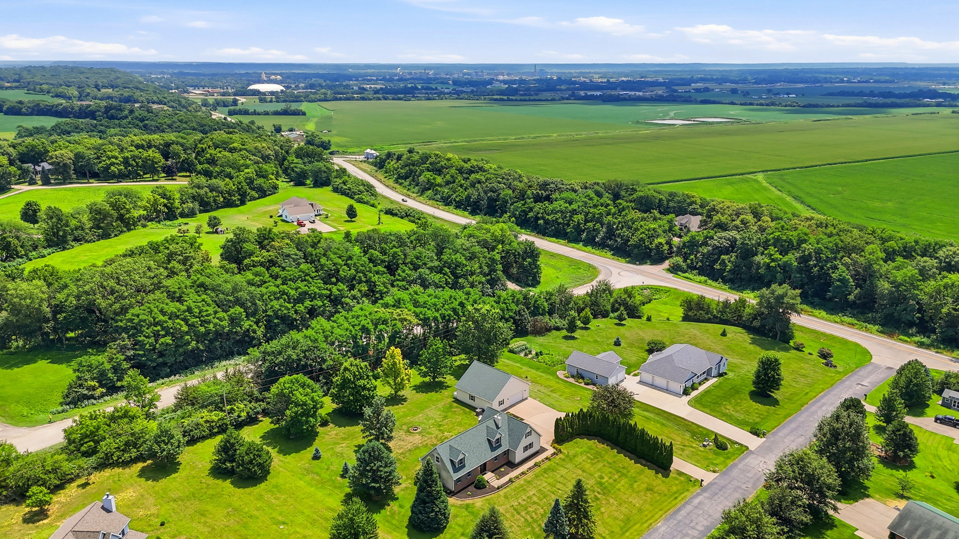 2237 Hickory Hills Road Muscatine, IA 52761 - Photo 50 of 53 a view of a garden with a houses in the back