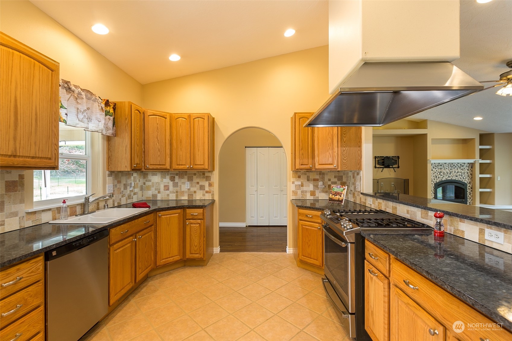 371 Autumn Road Sequim, WA 98382 - Photo 12 of 39 a kitchen with stainless steel appliances granite countertop a stove and a sink