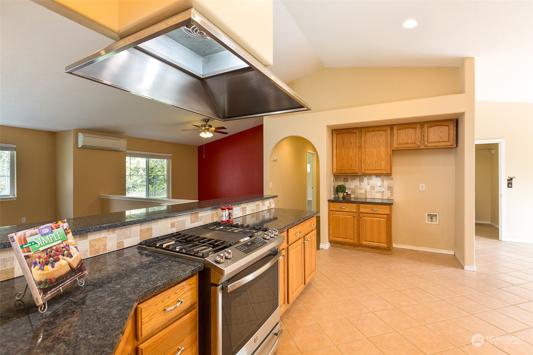 371 Autumn Road Sequim, WA 98382 - Photo 14 of 39 a kitchen with stainless steel appliances granite countertop a stove and a sink