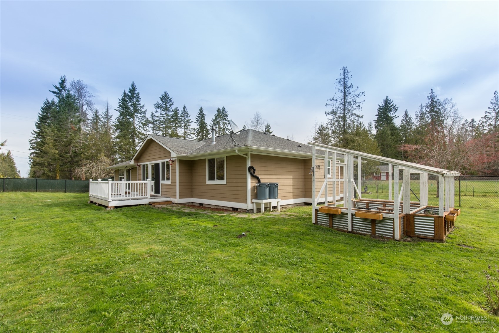 371 Autumn Road Sequim, WA 98382 - Photo 2 of 39 a front view of a house with garden