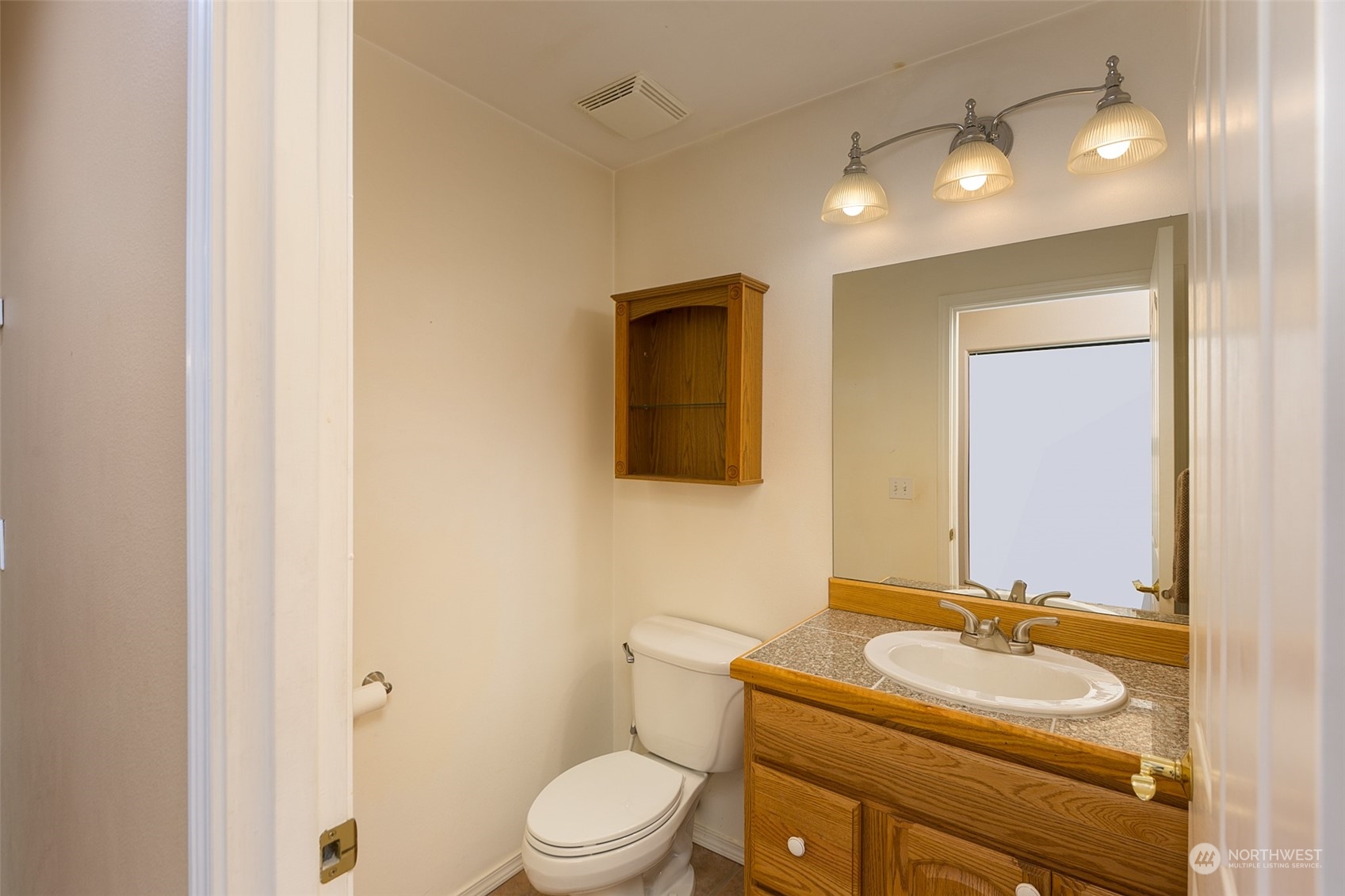 371 Autumn Road Sequim, WA 98382 - Photo 23 of 39 a bathroom with a sink toilet vanity and mirror