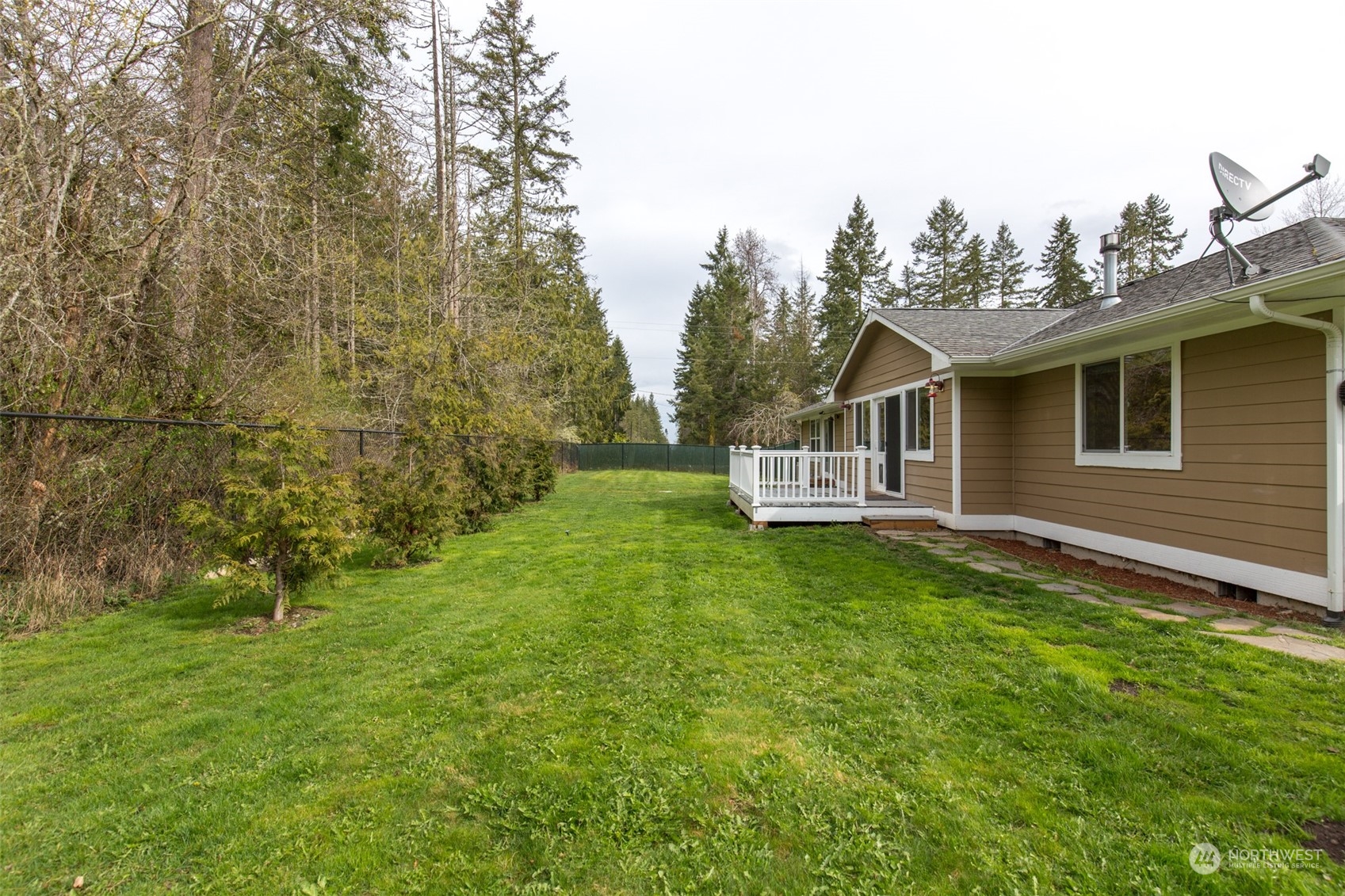 371 Autumn Road Sequim, WA 98382 - Photo 36 of 39 a house with green field in front of it