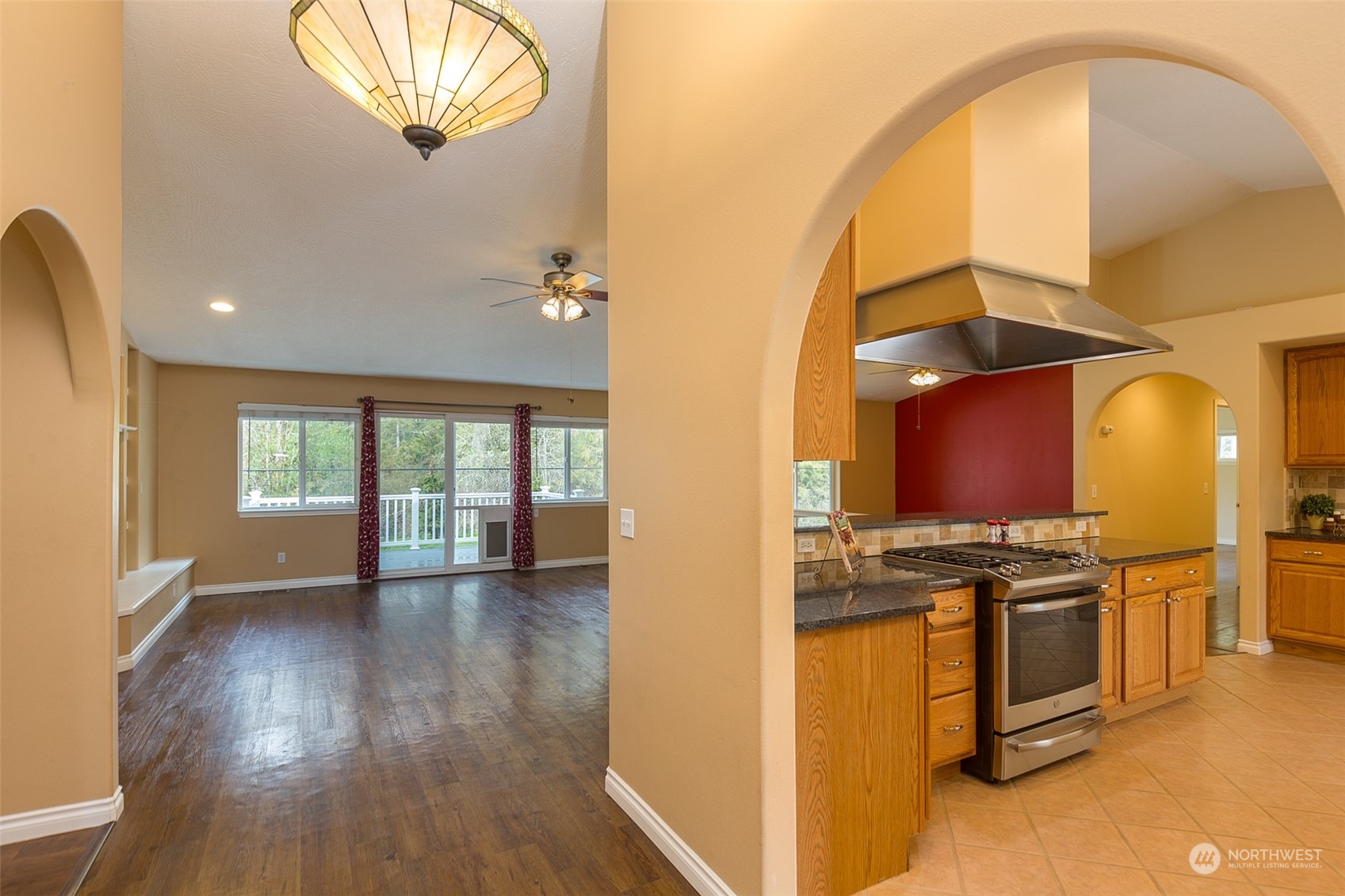 371 Autumn Road Sequim, WA 98382 - Photo 5 of 39 a view of a kitchen with stainless steel appliances granite countertop a stove top oven