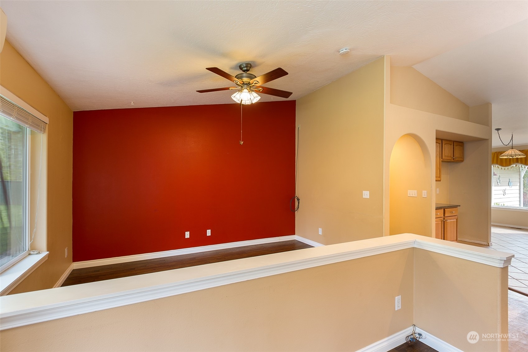 371 Autumn Road Sequim, WA 98382 - Photo 10 of 39 a view of a room with a chandelier fan and wooden floor