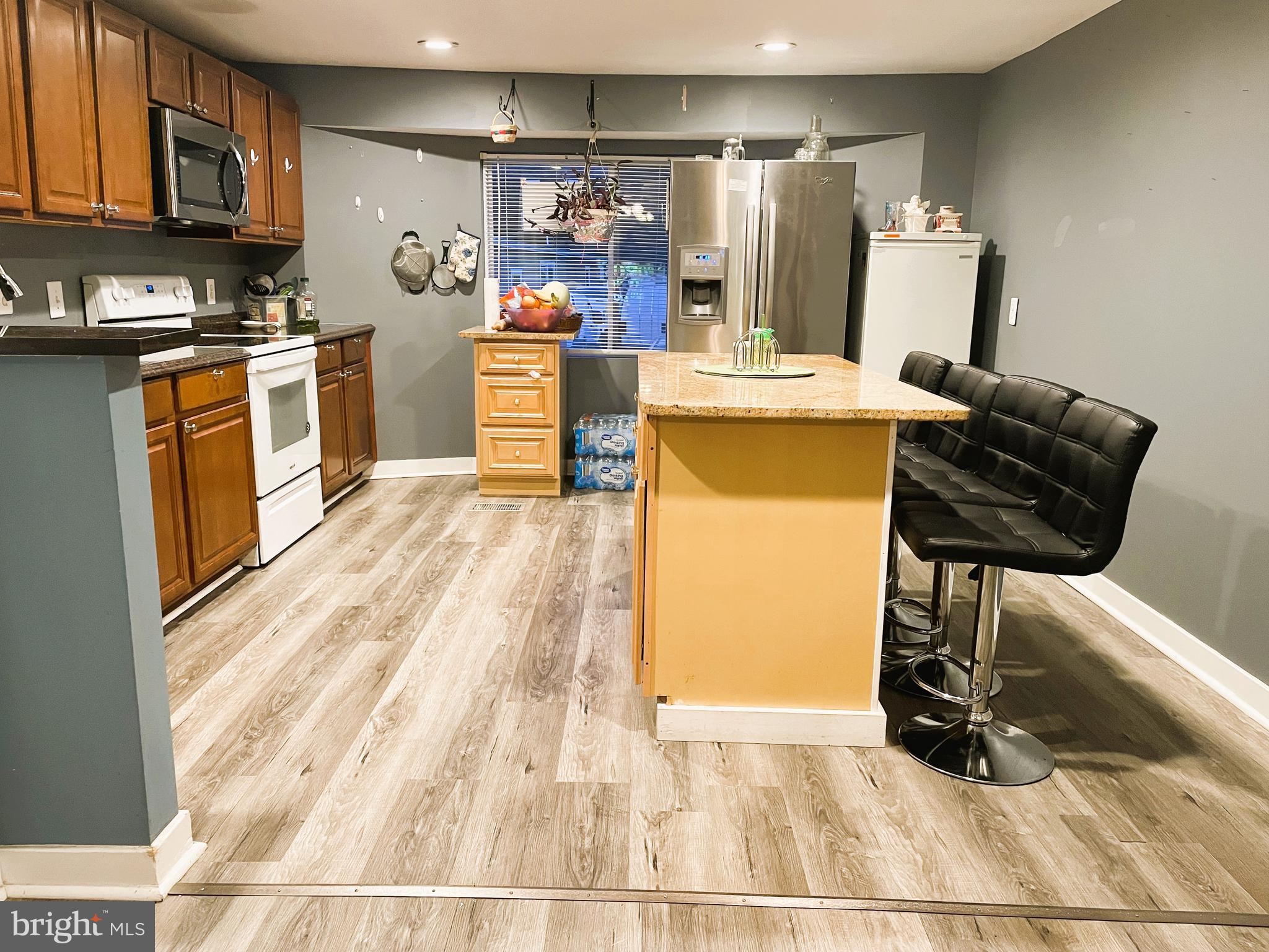 31 Courage Lane Stafford, VA 22554 - Photo 5 of 14 a view of a kitchen with fridge and workspace