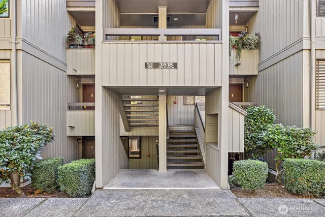 a front view of a house with large windows