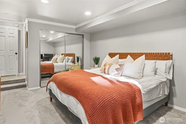 a bedroom with a bed and lamp