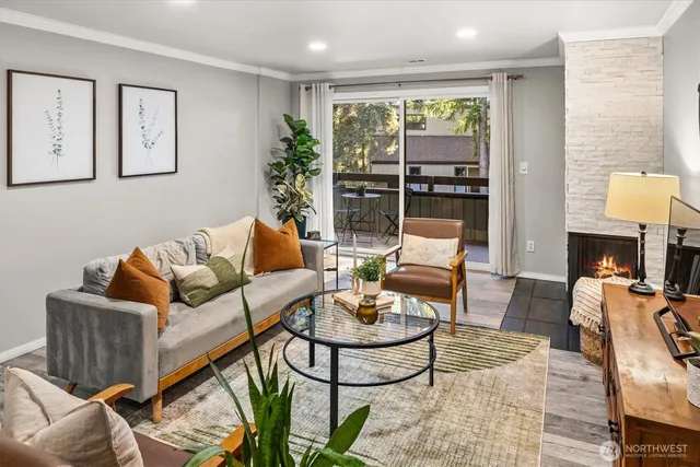 a living room with furniture and a large window