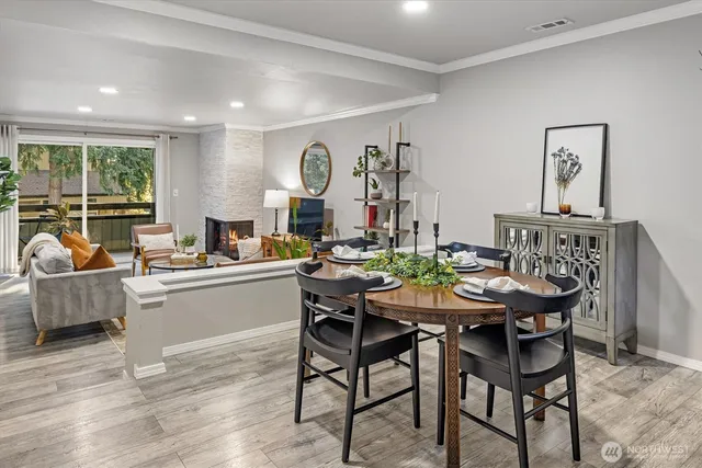 a view of a dining room with furniture and wooden floor