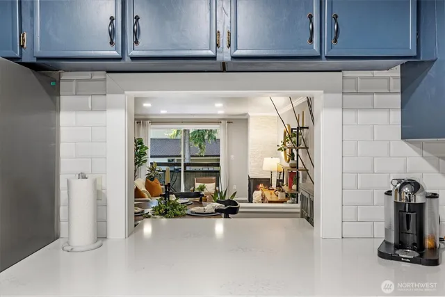 a view of a kitchen with a sink and cabinets