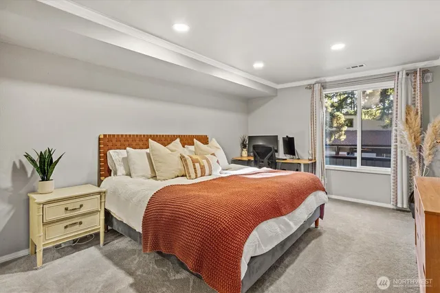 a bedroom with bed and wooden floor