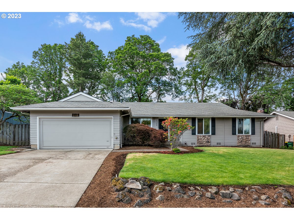 14720 Southwest Glenbrook Road Beaverton, OR 97007 - Photo 1 of 43 a front view of a house with a garden