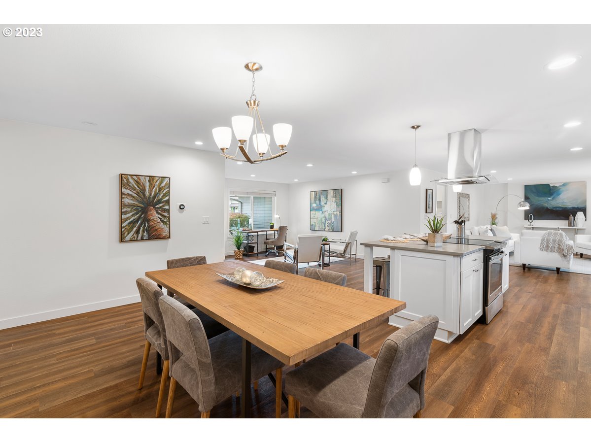 14720 Southwest Glenbrook Road Beaverton, OR 97007 - Photo 15 of 43 a view of a dining room with furniture and wooden floor