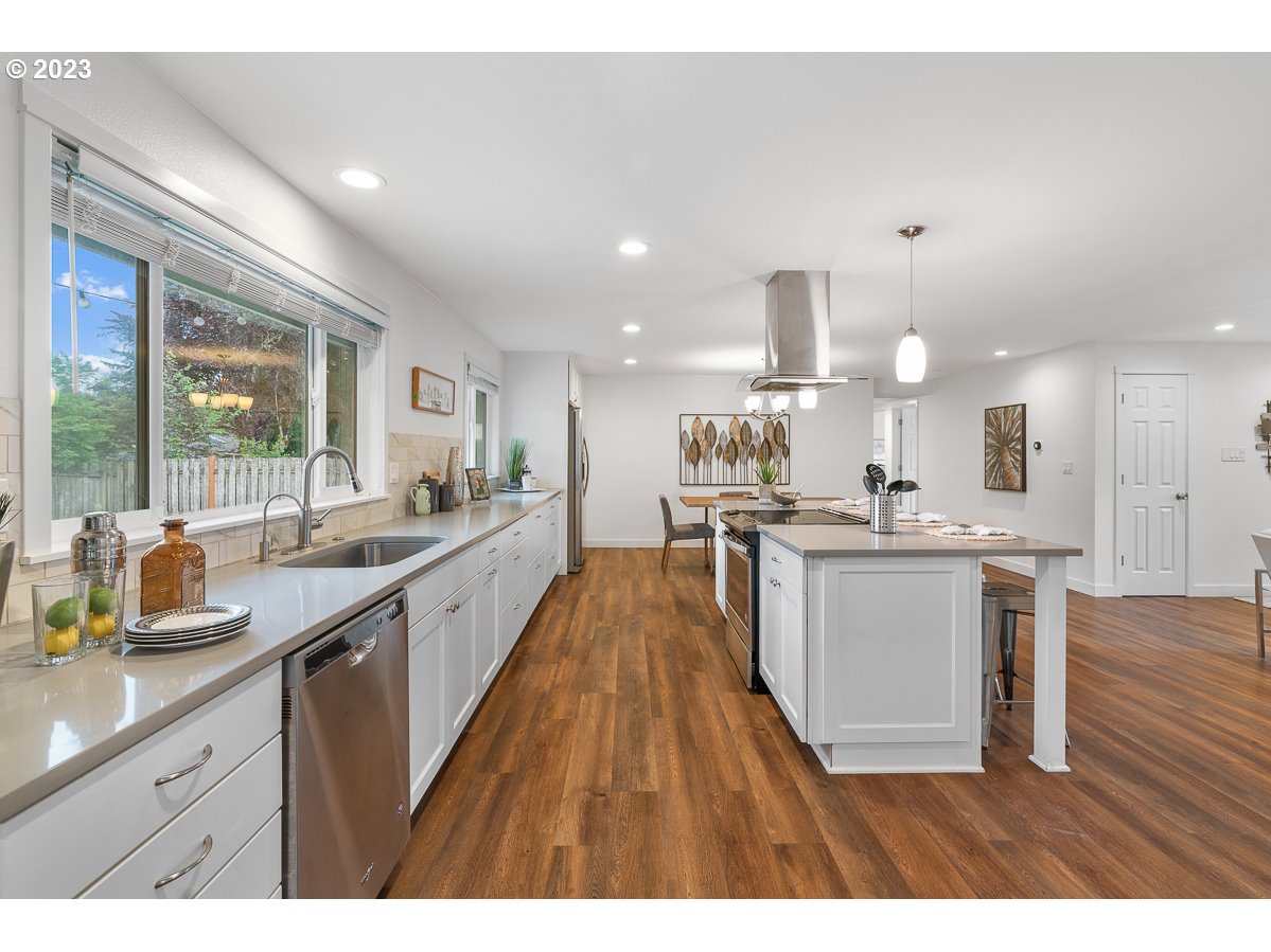 14720 Southwest Glenbrook Road Beaverton, OR 97007 - Photo 17 of 43 a kitchen with a sink and wooden floor
