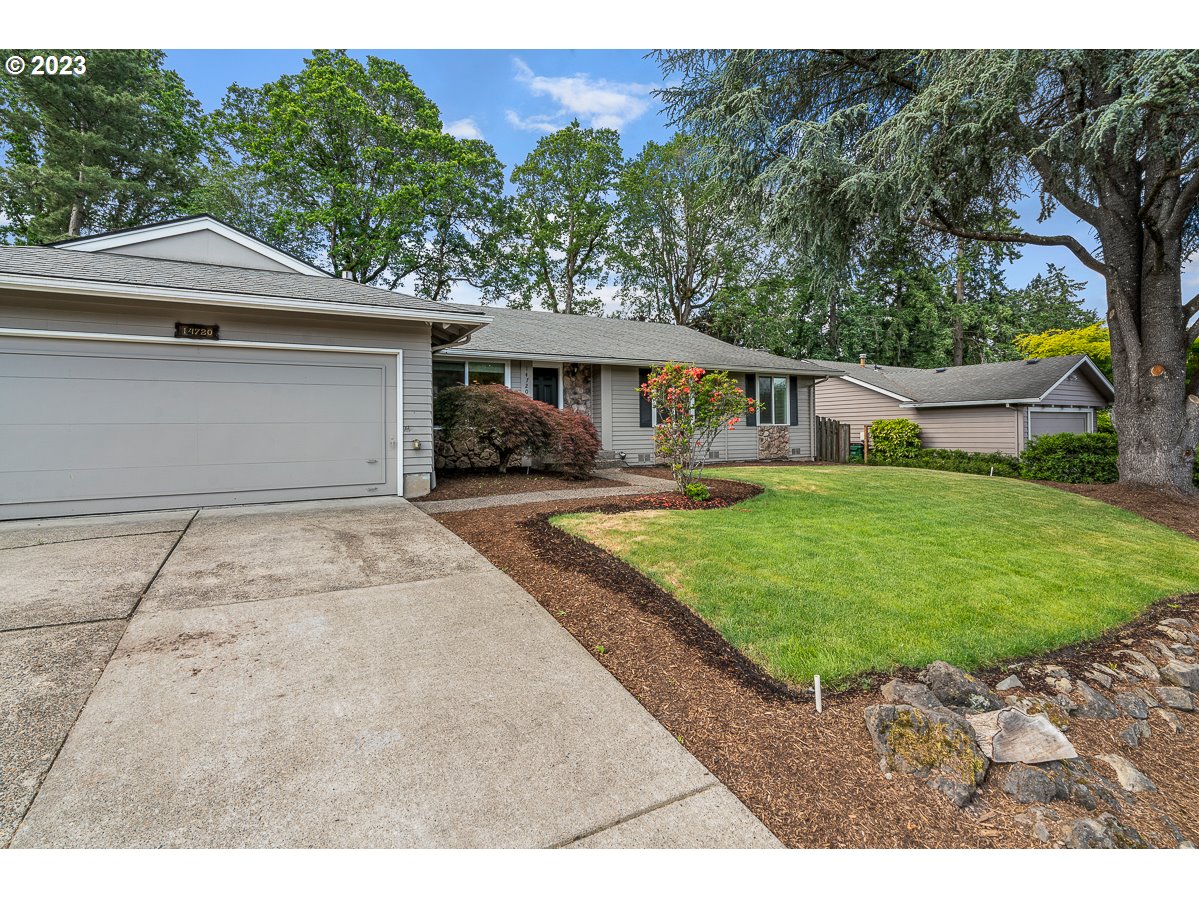 14720 Southwest Glenbrook Road Beaverton, OR 97007 - Photo 2 of 43 a house view with a garden space