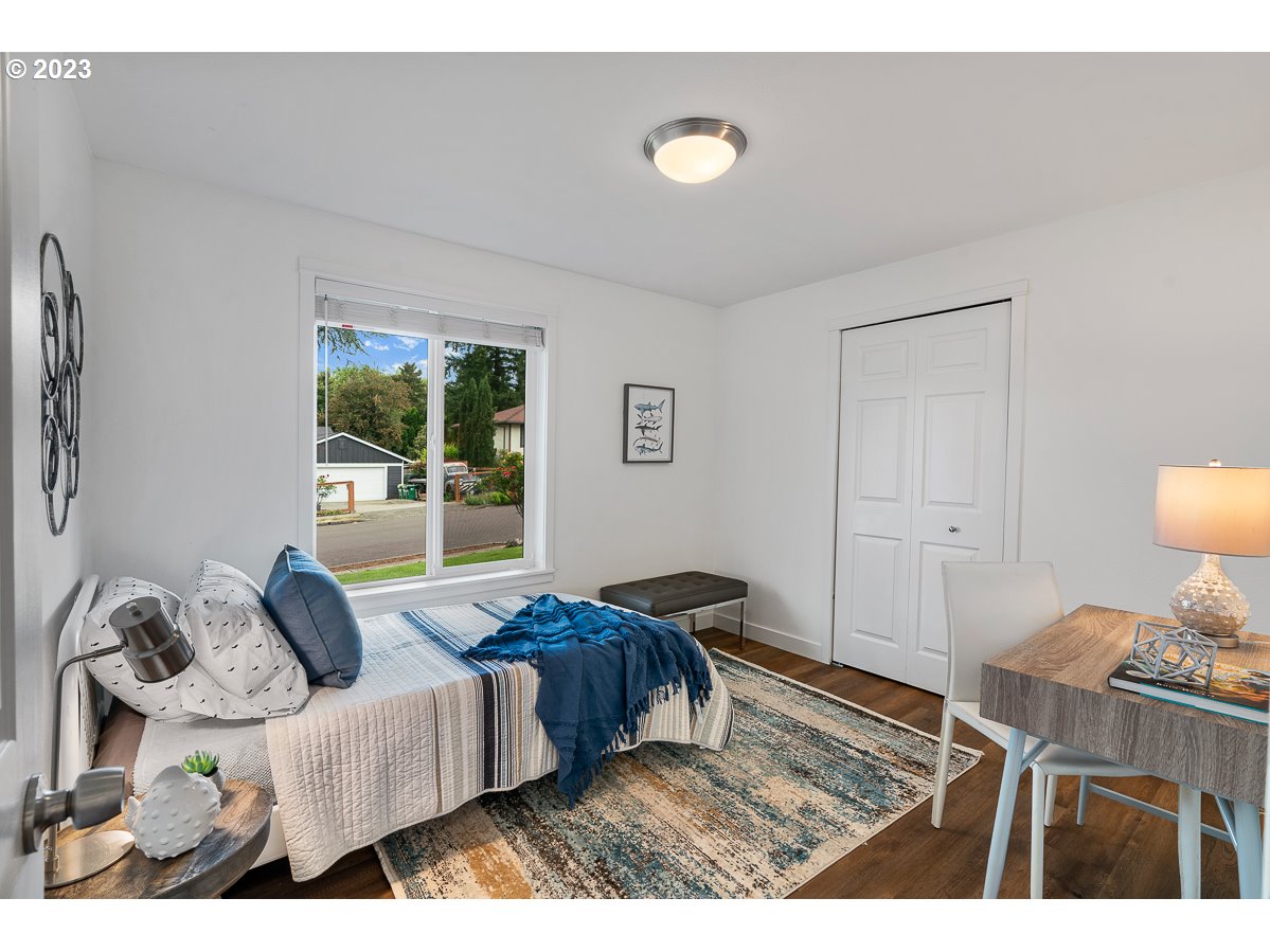 14720 Southwest Glenbrook Road Beaverton, OR 97007 - Photo 22 of 43 a living room with furniture and a floor to ceiling window