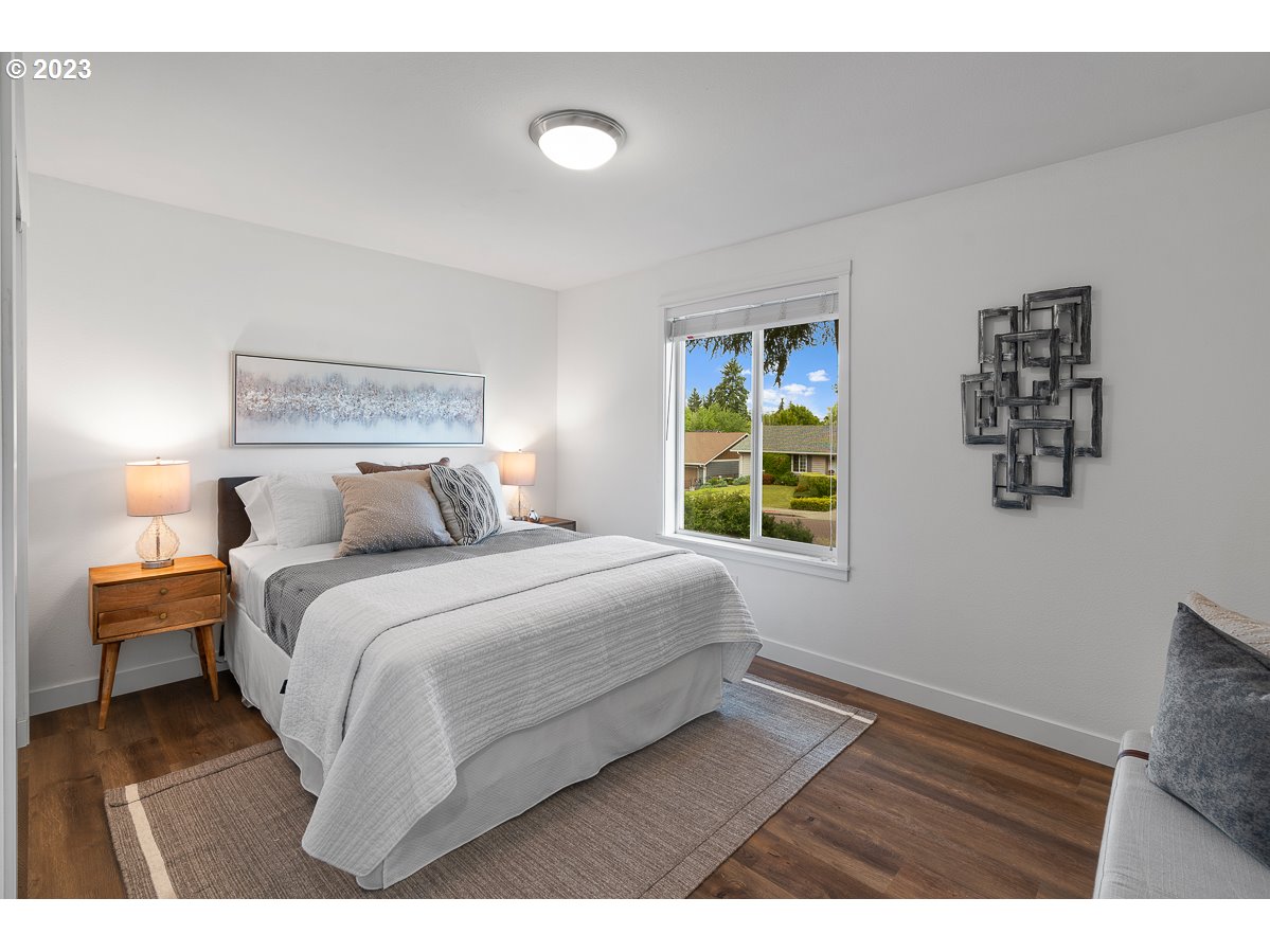 14720 Southwest Glenbrook Road Beaverton, OR 97007 - Photo 24 of 43 a bedroom with a bed and a window