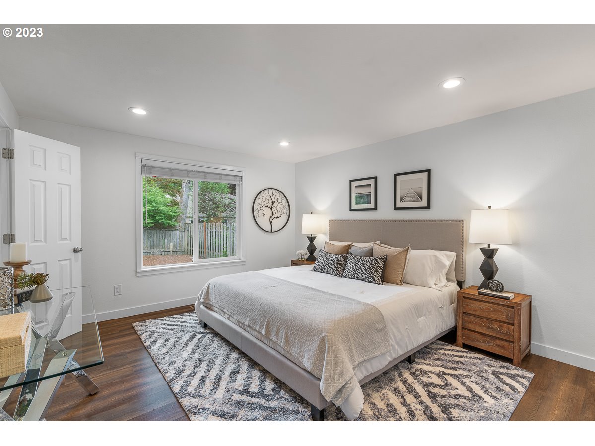 14720 Southwest Glenbrook Road Beaverton, OR 97007 - Photo 26 of 43 a bedroom with a large bed and a window