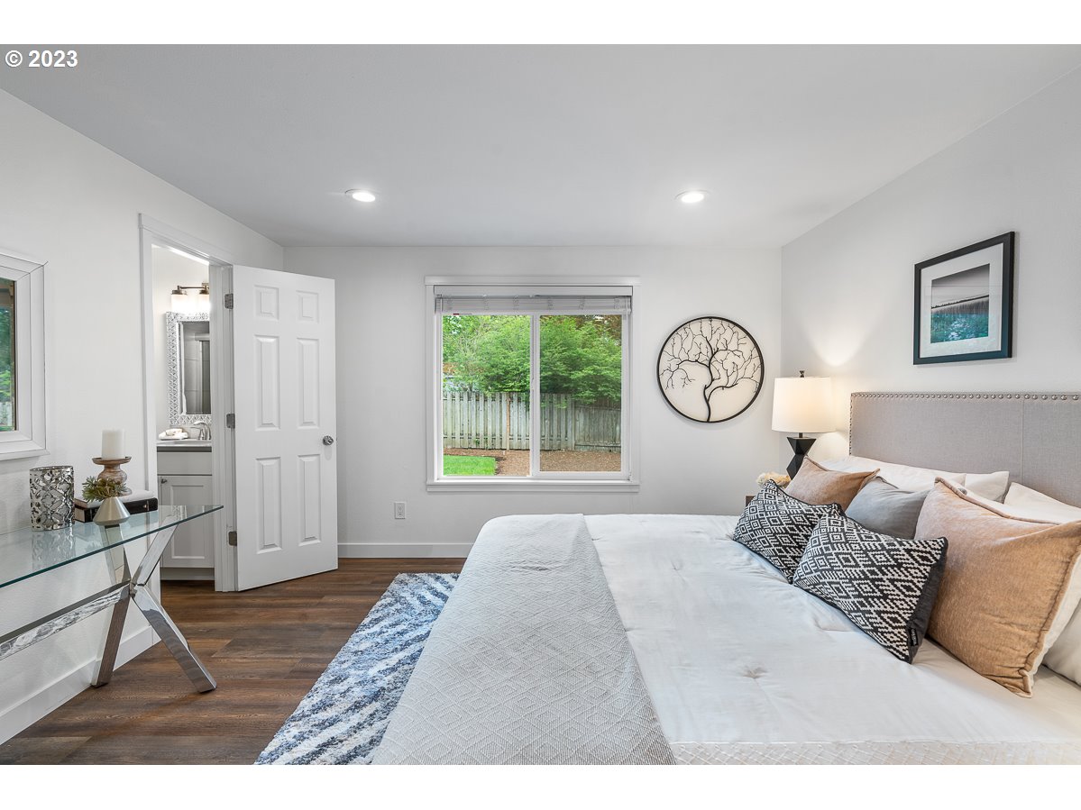 14720 Southwest Glenbrook Road Beaverton, OR 97007 - Photo 27 of 43 a living room with a bed furniture and a window