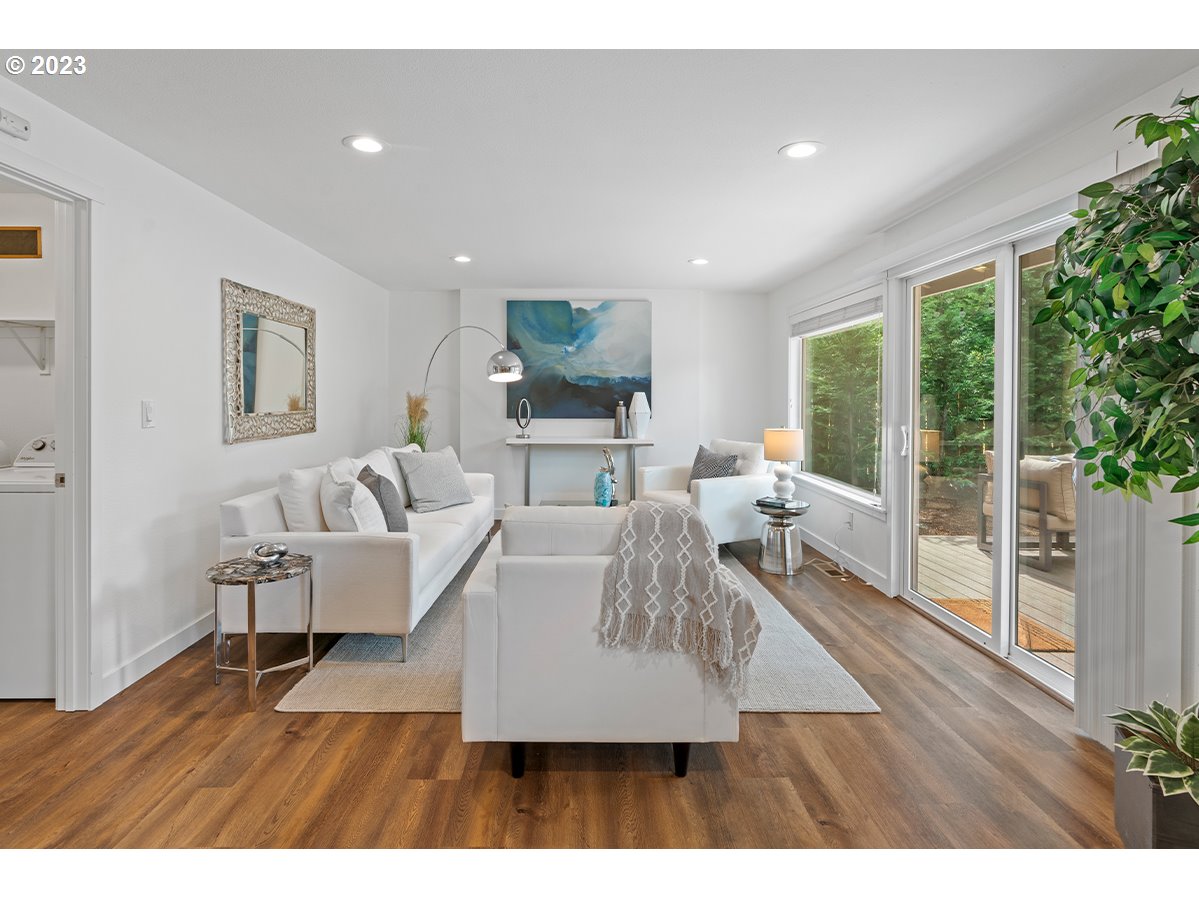 14720 Southwest Glenbrook Road Beaverton, OR 97007 - Photo 3 of 43 a living room with furniture and a flat screen tv