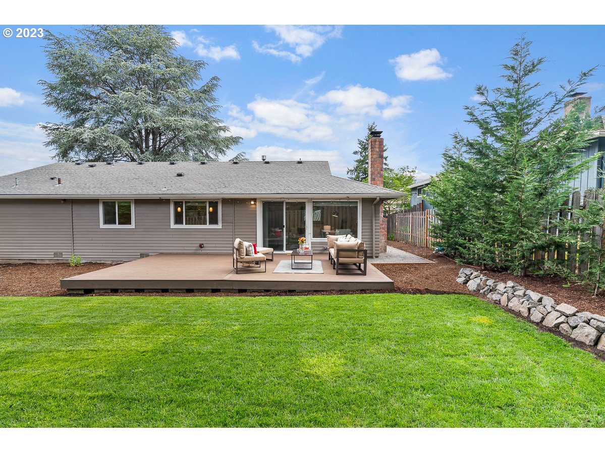 14720 Southwest Glenbrook Road Beaverton, OR 97007 - Photo 34 of 43 a front view of a house with patio and garden