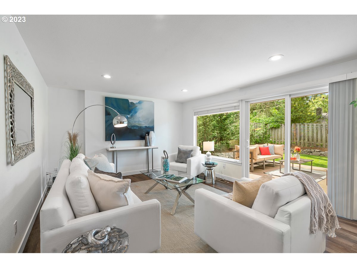 14720 Southwest Glenbrook Road Beaverton, OR 97007 - Photo 4 of 43 a living room with furniture and a large window