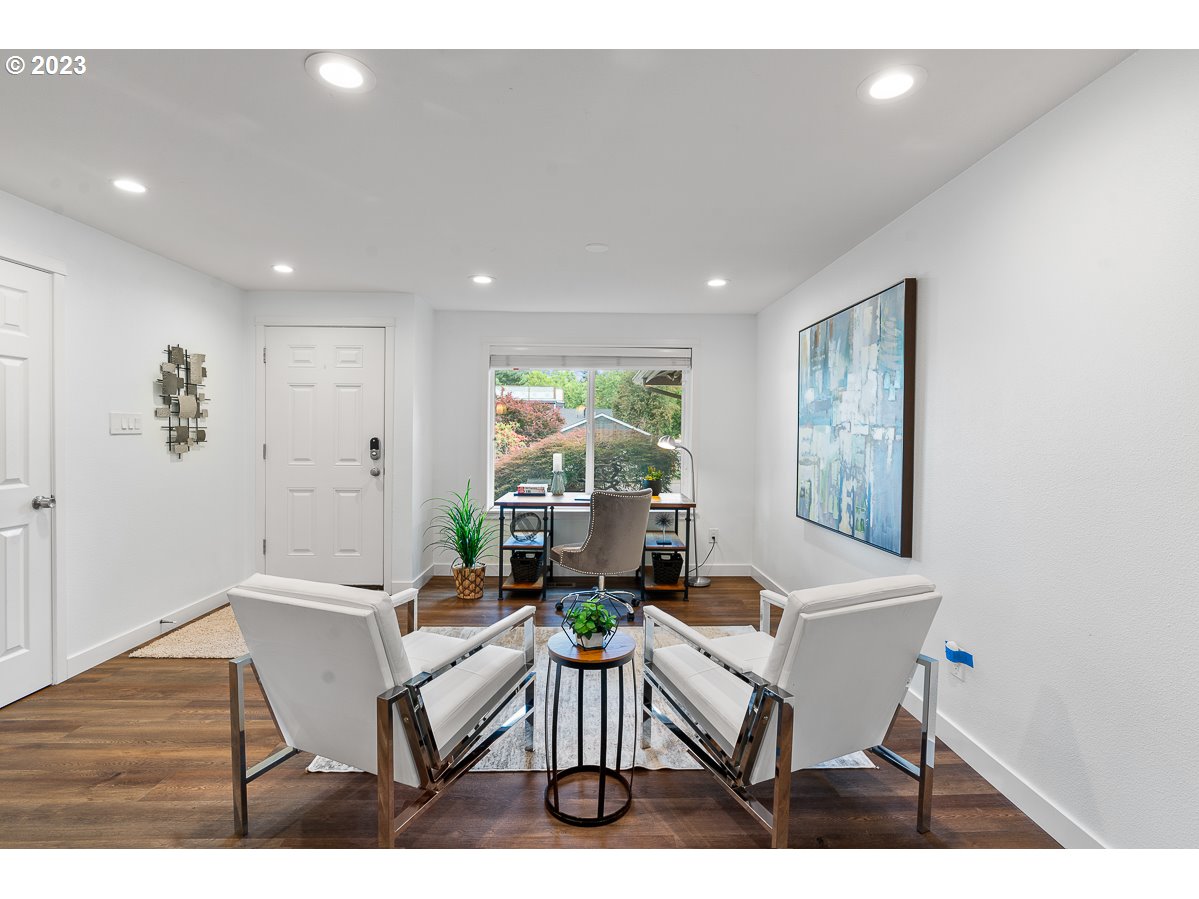 14720 Southwest Glenbrook Road Beaverton, OR 97007 - Photo 9 of 43 a living room with furniture and a large window